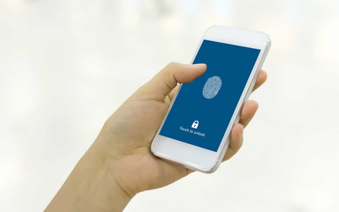 Hand holding smartphone and scan fingerprint biometric identity for unlock her mobile phone